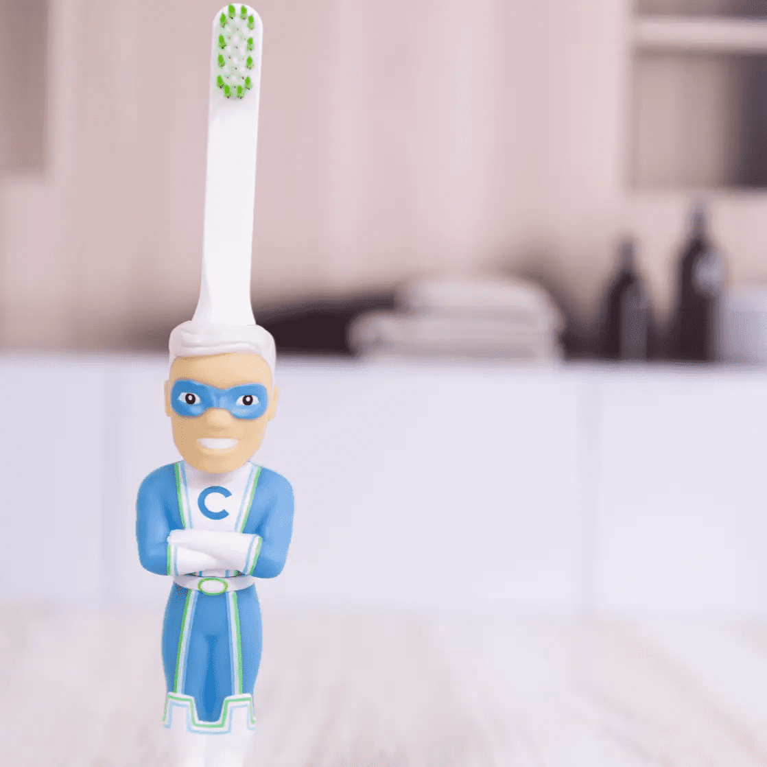 Captain Cavity superhero toothbrush shaped like a figurine