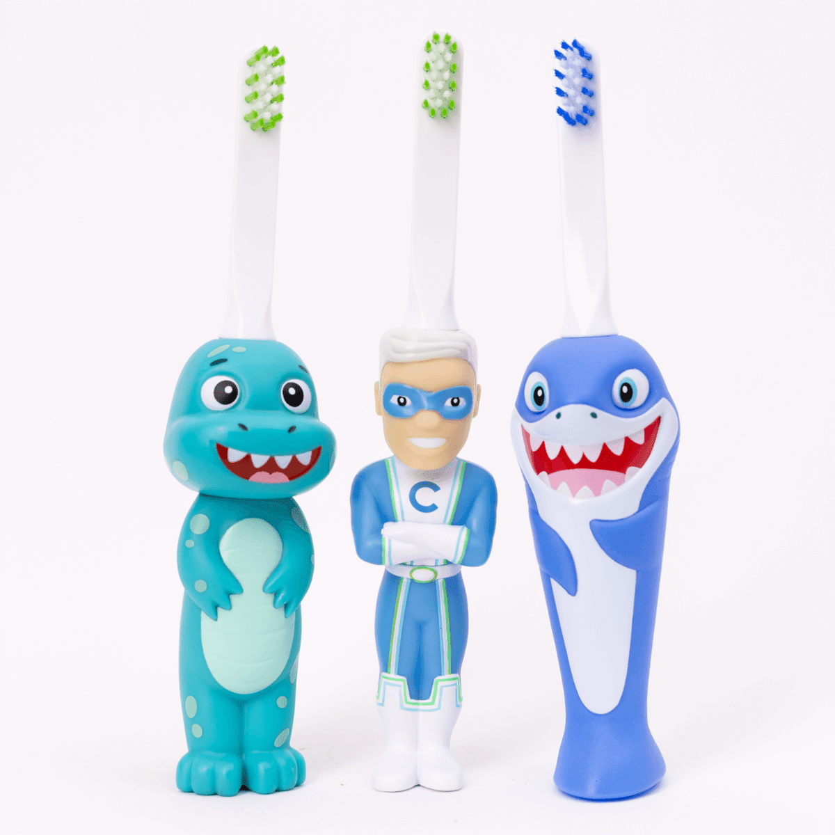 Set of three toothbrushes with Captain Cavity and cartoonish designs