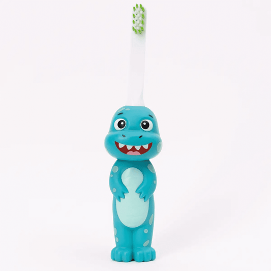 A blue Brushy the Brushasaurus toothbrush with a dinosaur